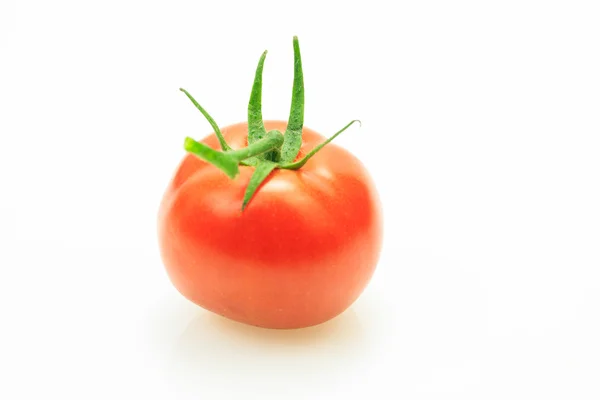 Red fresh tomato with stem, on white background. — Stock Photo, Image