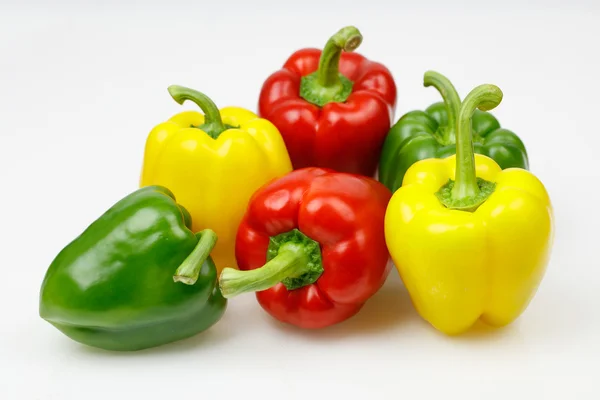 Colorful bell peppers, on white background. — Stock Photo, Image