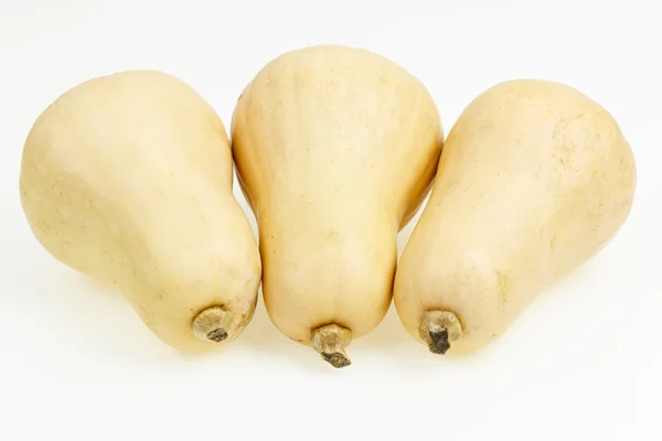 Trzy owoce butternut squash, na białym tle. — Zdjęcie stockowe