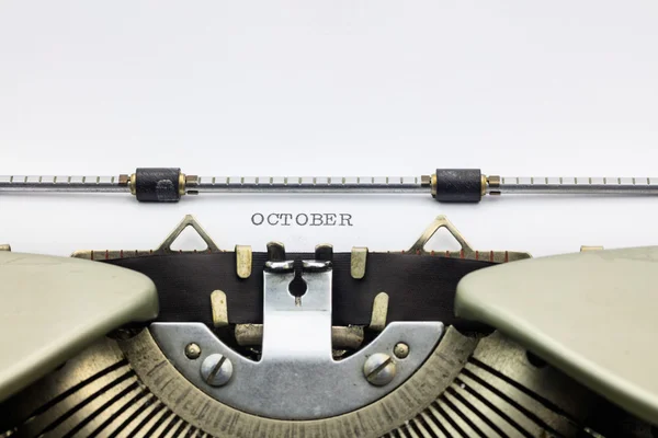 Oktober woord in hoofdletters op wit vel — Stockfoto