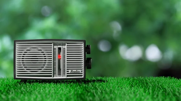 Transístor de rádio antigo em grama verde e fundo bokeh verde. Renderização 3D — Fotografia de Stock