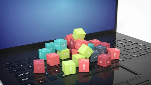 Renderização 3D de cubos com nomes de domínio no teclado do laptop preto — Fotografia de Stock
