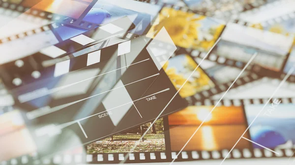 Clapperboard na taśmy filmowe z streszczenie tło Zdjęcia — Zdjęcie stockowe