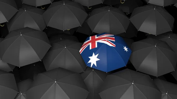 New Zealand flag over black umbrellas