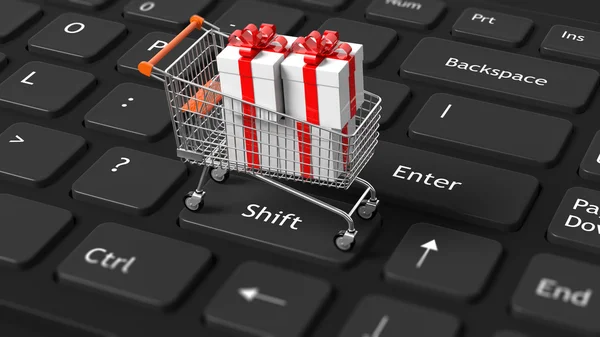 Shopping Cart with present on keyboard — Stock Photo, Image