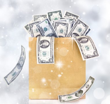 Doları banknot ışıltılı ışıklarını arka planda bir kağıt torba