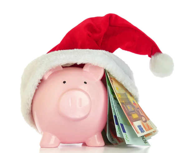 Piggy bank with Santa Claus hat and money on white background — Stock Photo, Image