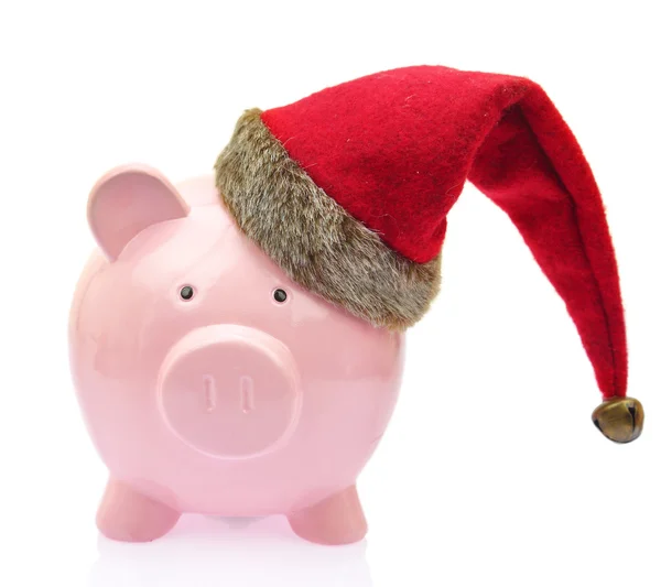 Piggy bank with Santa Claus hat on white background — Stock Photo, Image