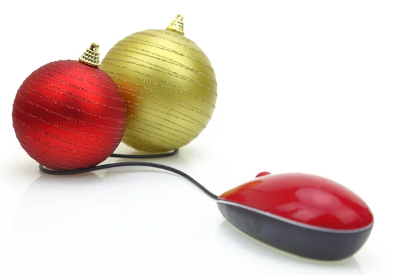 Christmas ornaments connected to a computer mouse — Stock Photo, Image