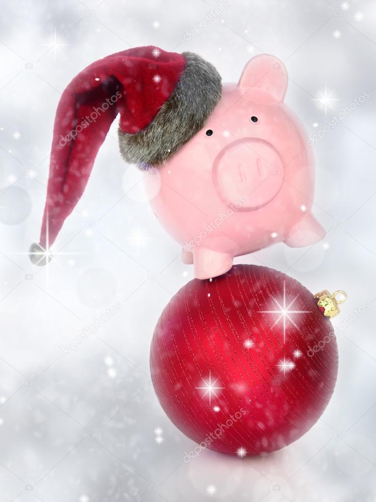 Piggy bank on a Christmas ball in a glittery background