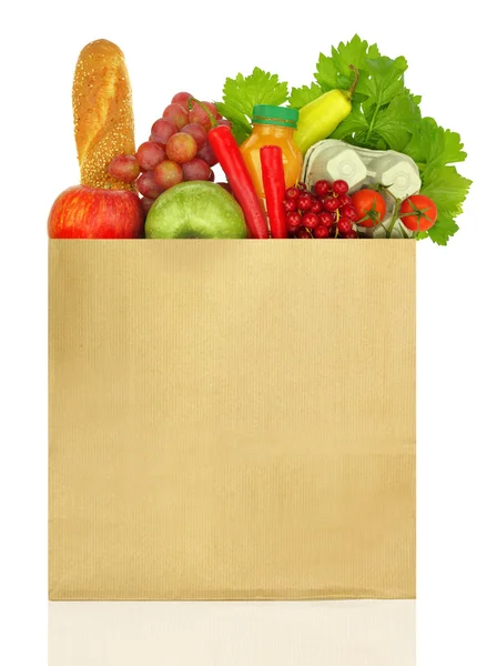 Paper bag full of groceries isolated on white — Stock Photo, Image