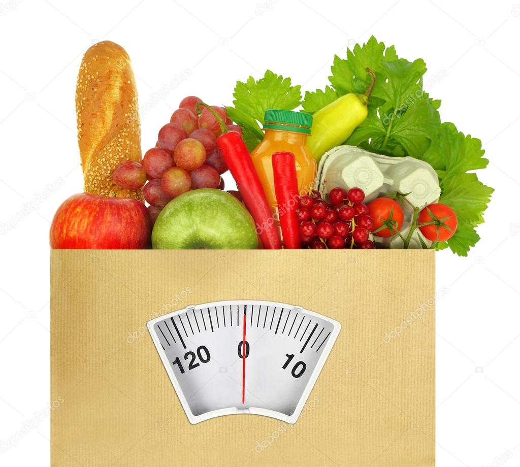 Paper bag full of groceries with weighing scale