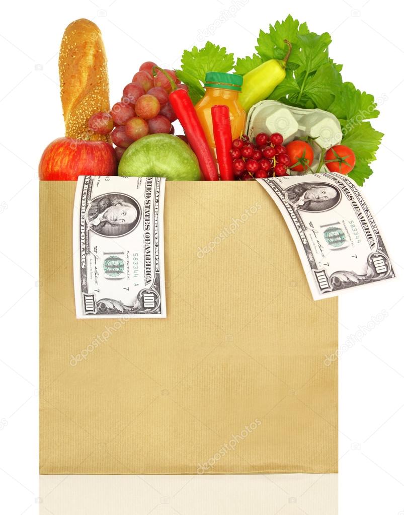 Paper bag filled with groceries and banknotes
