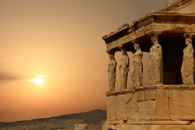 Caryatids on the Athenian Acropolis at sunset, Greece clipart