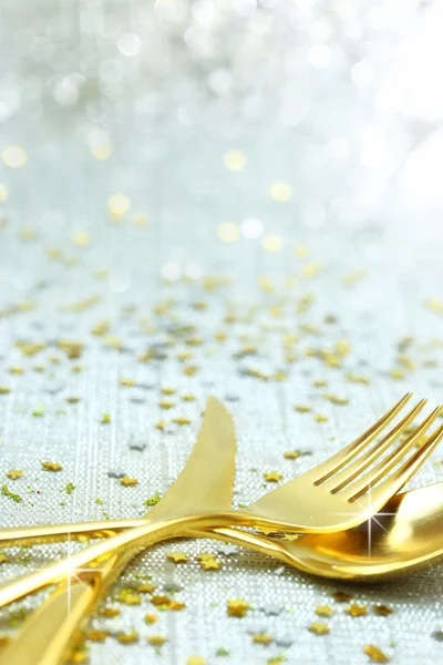 Christmas golden cutlery on festive background — Stock Photo, Image