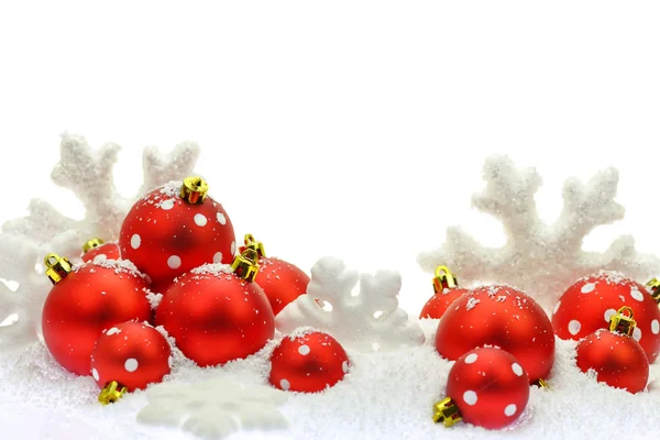 Christmas ornaments on the snow — Stock Fotó