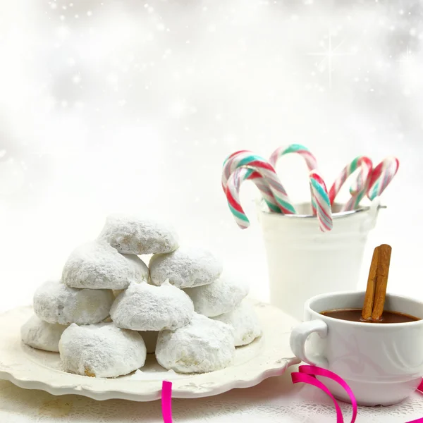 Christmas cookies with candies and coffee on white bokeh background — Stock Photo, Image