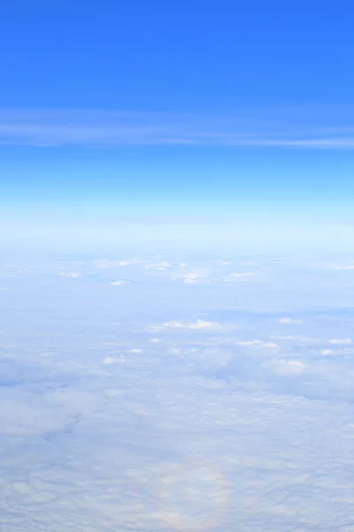 Blue sky over the surface of white clouds, aerial photography — Stock Photo, Image