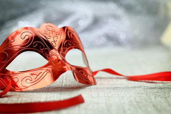 Vintage carnival mask in front of glittering background — Stock Photo, Image