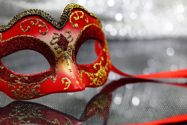 Vintage carnival mask in front of glittering background — Stock Photo, Image