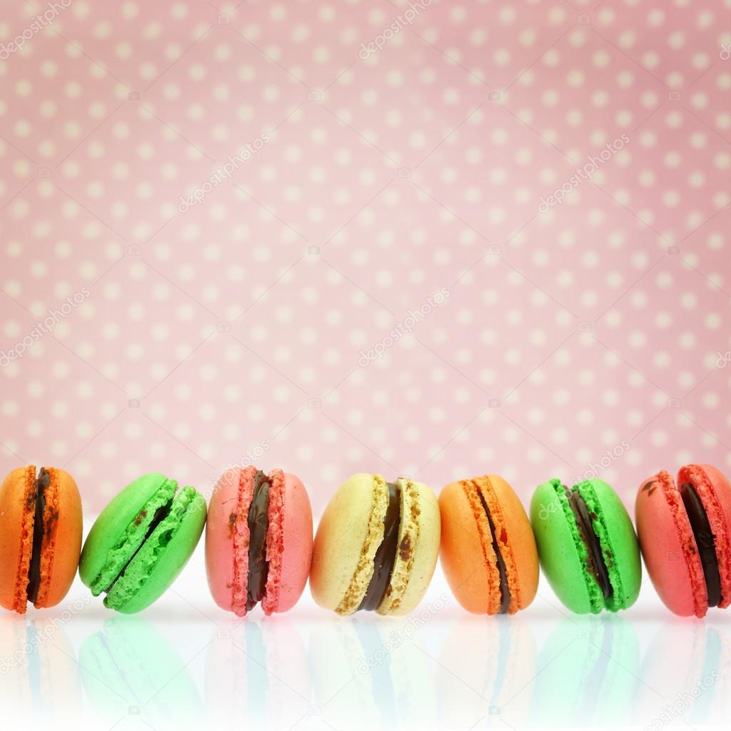 Traditional french colorful macaroons on retro background