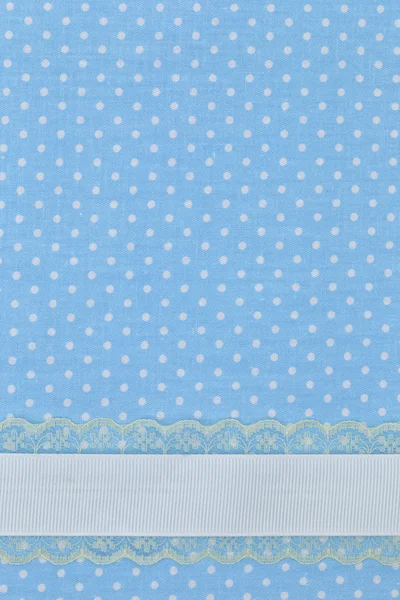 Blauwe retro polka dot textiel achtergrond met lint — Stockfoto