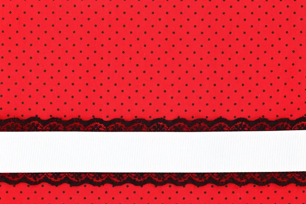 Red retro polka dot textile background with ribbon