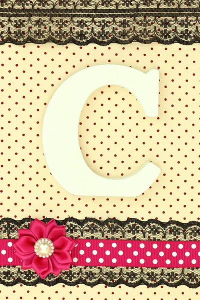 Wooden letter C on polka dots background — Stock Photo, Image