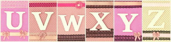 Wooden letters U V W X Y Z on polka dots background — Stock Photo, Image