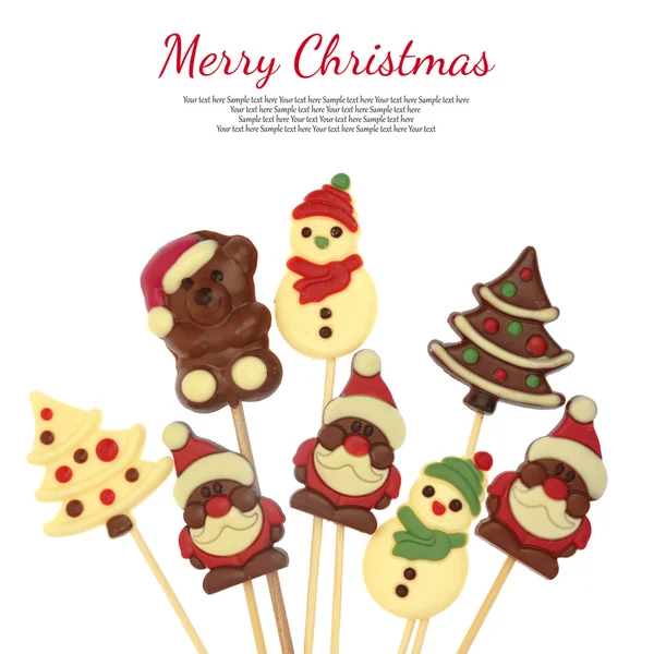 Festive Christmas chocolate confectionery on a stick isolated on white — Stock Photo, Image