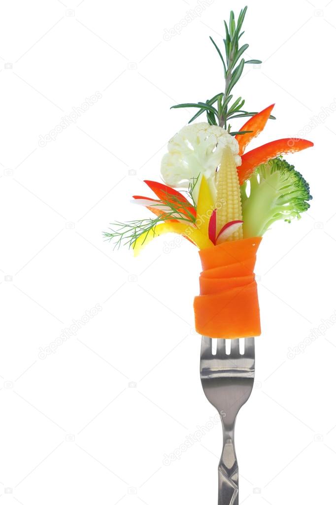Fresh colorful vegetables on fork, isolated on white
