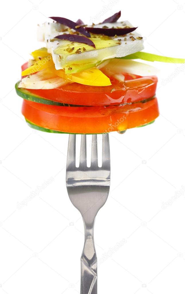 Fresh cheese with vegetables on fork, isolated on white