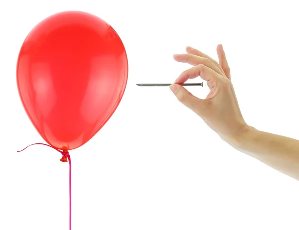 Unha prestes a estourar um balão isolado em branco — Fotografia de Stock