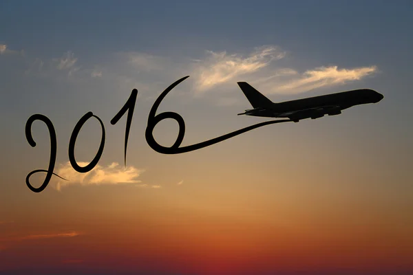 Nuevo año 2016 dibujo en avión en el aire al atardecer — Foto de Stock