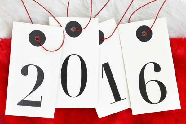 Ano Novo 2016 em etiquetas em peles de Pai Natal — Fotografia de Stock