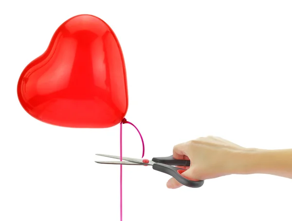Nożyczki do "uwolnić" serce balonu na białym tle — Zdjęcie stockowe