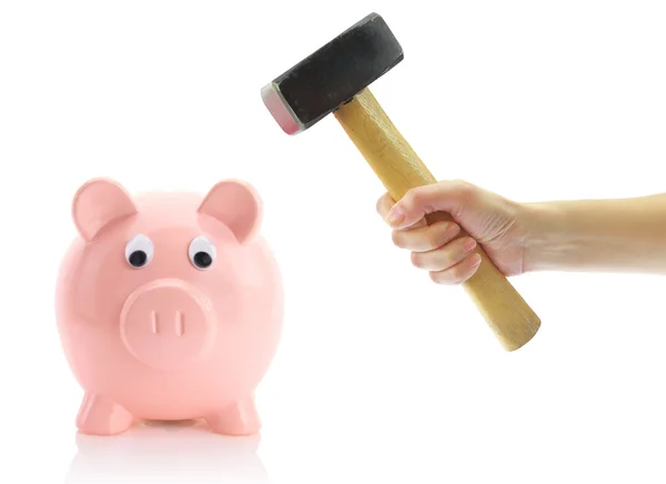 Hand with hammer and piggy bank, isolated on white — Stock Photo, Image