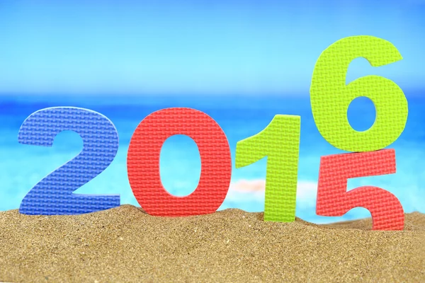 New year number 2016 on the beach Royalty Free Stock Images