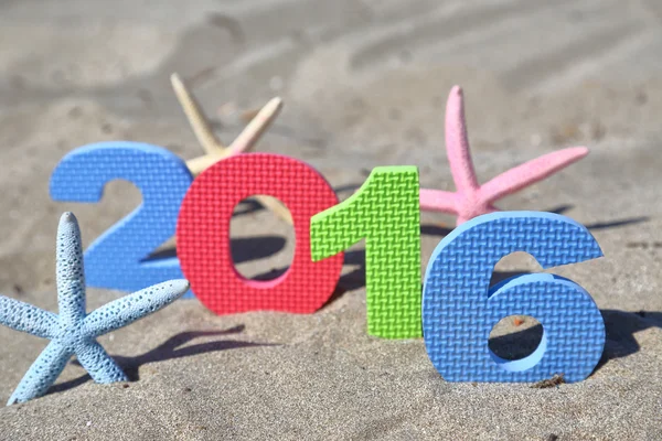 New year number 2016 on the beach — Stock Photo, Image