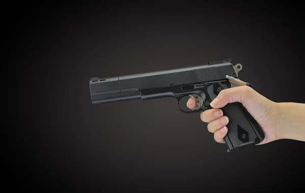 Pistola de mano aislada en negro —  Fotos de Stock
