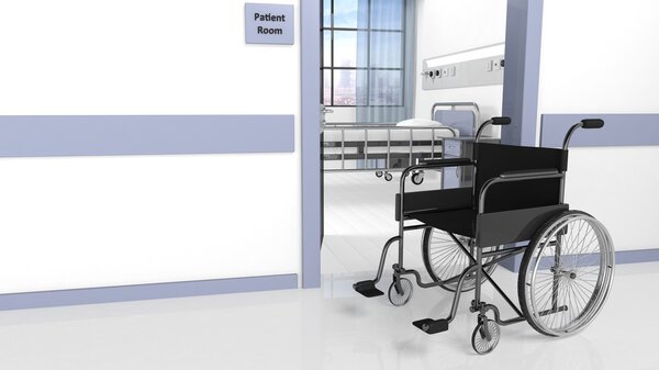 Чёрное инвалидное кресло перед палатой в больнице
 