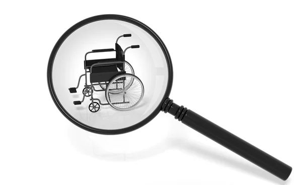 Black disability wheelchair under magnifier isolated on white — Stock Photo, Image