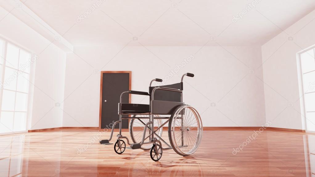 Black disability wheelchair inside empty room with wooden floor 