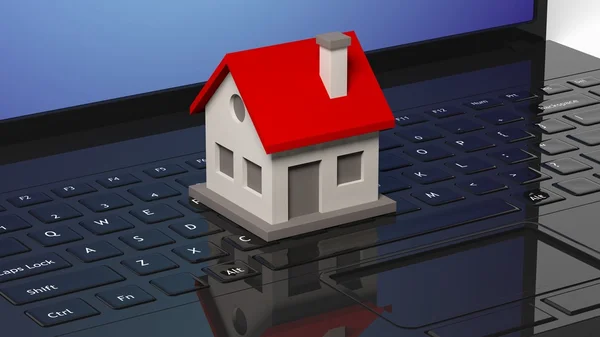 Modelo da casa no teclado de laptops preto — Fotografia de Stock