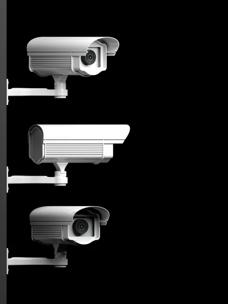Tři bezpečnostní kamery boční pohled izolovaných na černém pozadí — Stock fotografie
