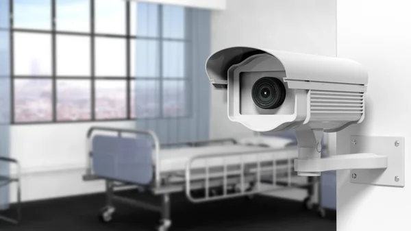 Câmera de vigilância de segurança na parede em um quarto de hospital — Fotografia de Stock