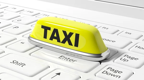 Yellow taxi car roof sign on white laptop keyboard — Stock Photo, Image