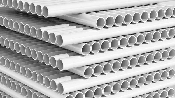 Белые пластиковые трубы стеки крупным планом фона — стоковое фото