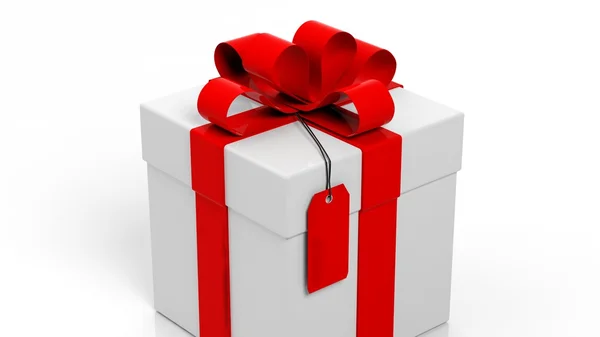 Gift box with red ribbon and blank tag isolated on white — Stock Photo, Image