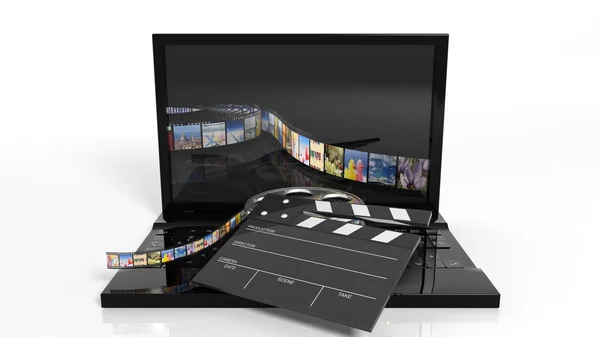 Clapperboard and film reel on black laptops keyboard isolated on white — Stock Photo, Image